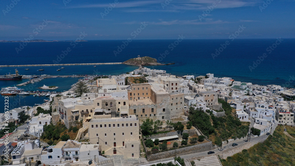 Aerial drone photo of iconic port of Naxos island featuring uphill castle and beautiful Temple of Apollon or Gate, Cyclades, Greece