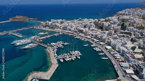 Aerial drone photo of iconic port of Naxos island featuring uphill castle and beautiful Temple of Apollon or Gate, Cyclades, Greece