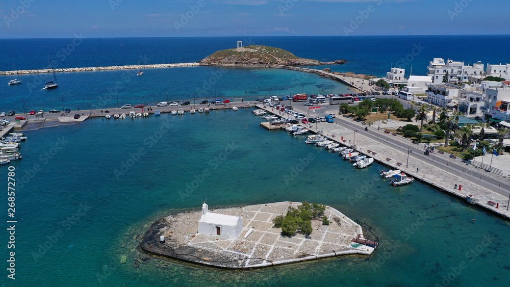 Fototapeta premium Aerial drone photo of iconic port of Naxos island featuring uphill castle and beautiful Temple of Apollon or Gate, Cyclades, Greece