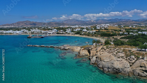 Fototapeta Naklejka Na Ścianę i Meble -  Aerial drone photo of breathtaking turquoise round sandy beach and small village and small seaside picturesque chapel of Agia Anna, Naxos island, Cyclades, Greece