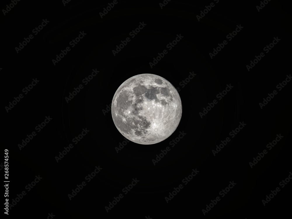 Full moon on the dark night sky