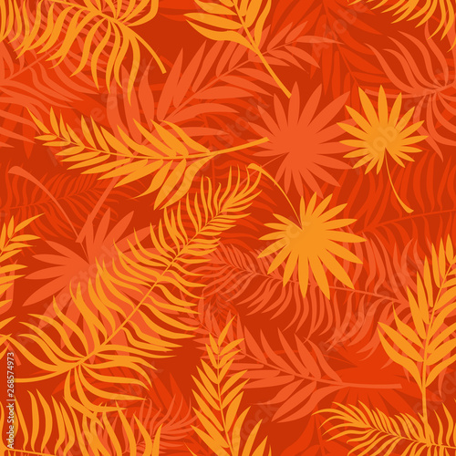 Seamless pattern made with yellow silhouettes of tropical leaves on orange background. Tropic folage texture.Vector flat illustration