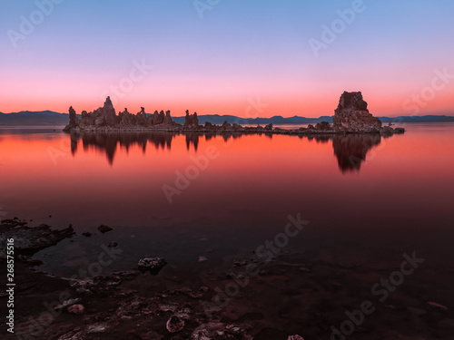 Fototapeta Naklejka Na Ścianę i Meble -  Colorful evening scenery at Mono Lake with tufa columns reflection in the water