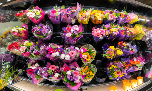 Fototapeta Naklejka Na Ścianę i Meble -  Colorful flowers for sale in a supermarket