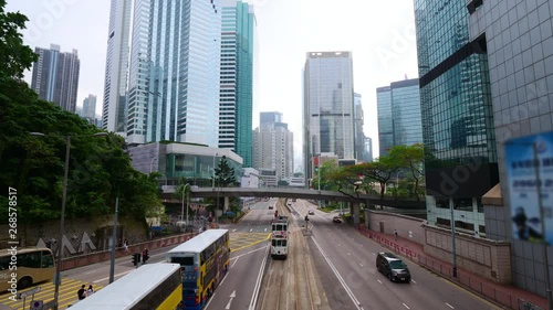 Time lapse of public transportation in the busy day on the road at Central district in Hong Kong city