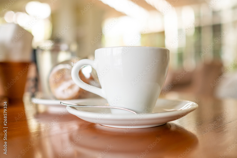 Selective focus of hot coffee latte in ceramic mug at coffee shop