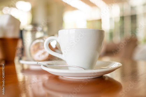 Selective focus of hot coffee latte in ceramic mug at coffee shop