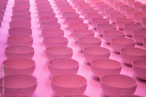 Abstract pink background. Sucker close up. Pattern of plastic cups.