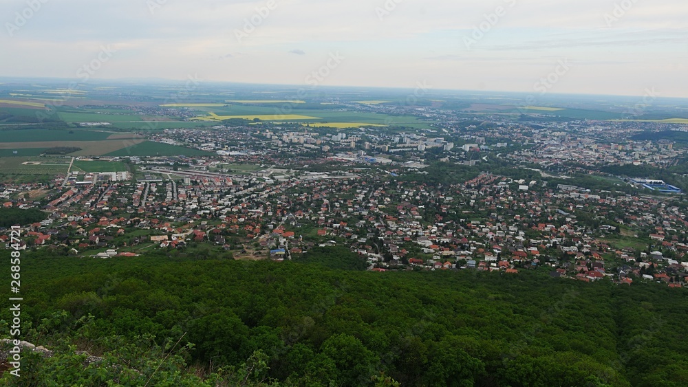 View of center of Nitra city, western Slovakia, from Zobor hill located above the city, cloudy spring day