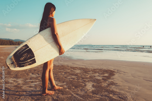 Photography Surfer woman in bikini go to surfing