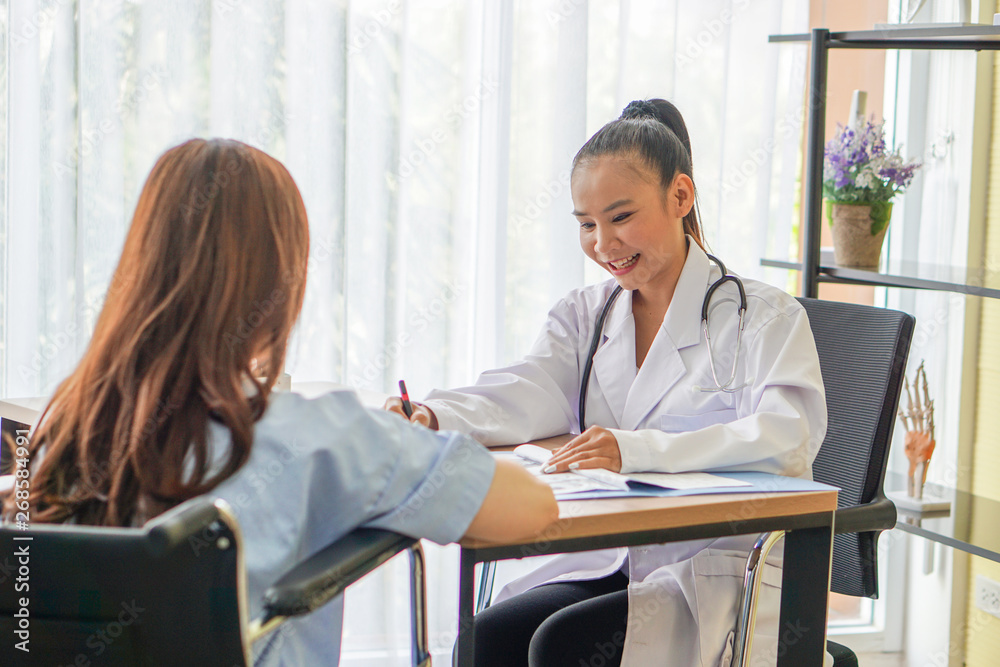 Female doctors talking about symtom for patients Female doctors talking about symtom for patients
