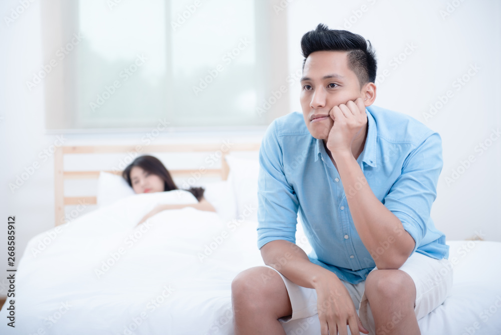Husband unhappy and disappointed in the erectile dysfunction during sex while his wife sleeping on the