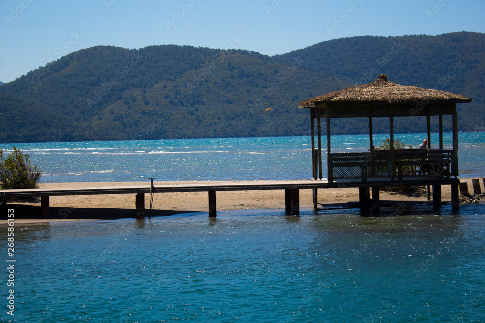 Jetty stretching towards the sea with an arbor at the end Jetty stretching towards the sea with an arbor at the end