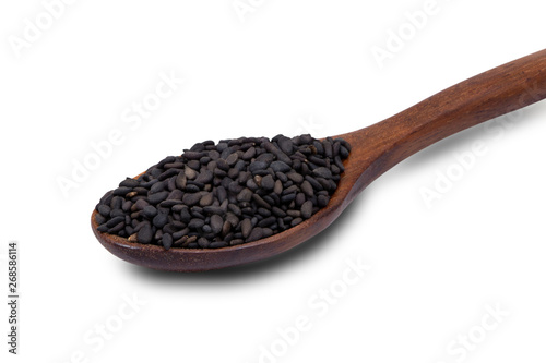 spoon with black sesame seeds isolated on white