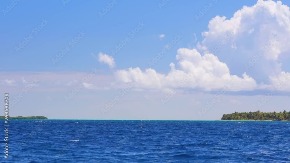 Dominican Republic and Saona island, middle point in Caribbean sea water and ripple waves of Atlantic ocean. Sailing in open waters. Dominican Republic and Saona island, middle point in Caribbean sea water and ripple waves of Atlantic ocean. Sailing in open waters.