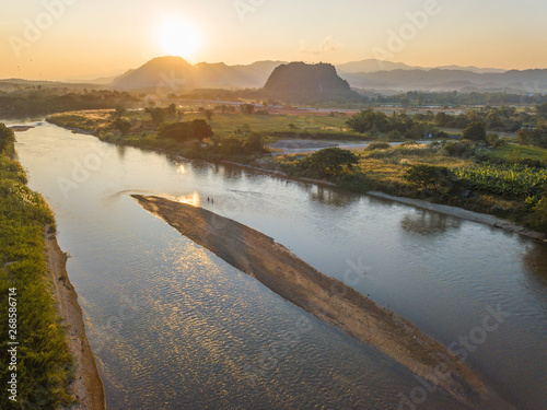 Beautiful sunset with Kok river the major river in Chiang Rai. Its waters originate from the mountains at Burma flowing through the province and draining in Mae Kong River.