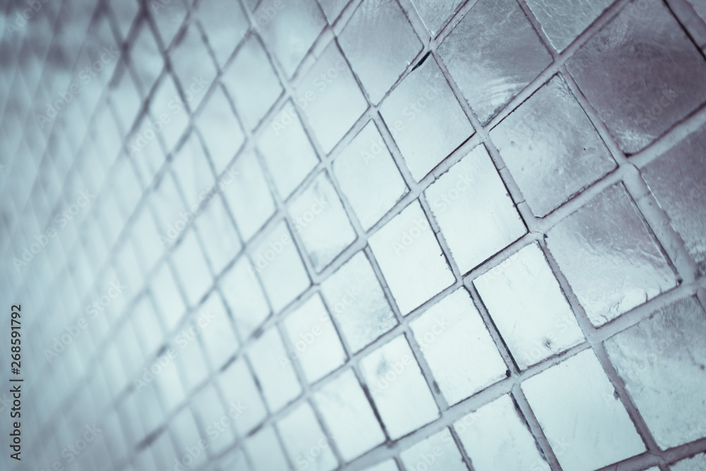 Beautiful closeup textures abstract tiles and silver and white color glass wall background and pattern Beautiful closeup textures abstract tiles and silver and white color glass wall background and pattern