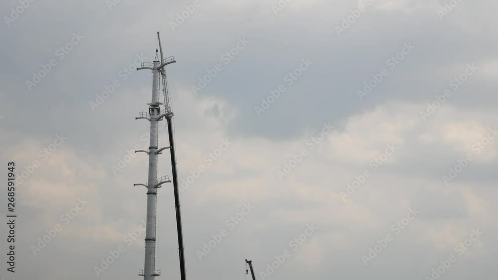 Scenic view of the installation of the high voltage tower. Scenic view of the installation of the high voltage tower.