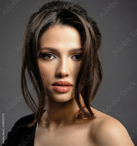 Beautiful woman with brown hair. Attractive model with brown eyes.