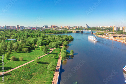 Scenic view of the city by the river with ships sailing on it. Concept clean city, life in the city. aerial shot, top shot
