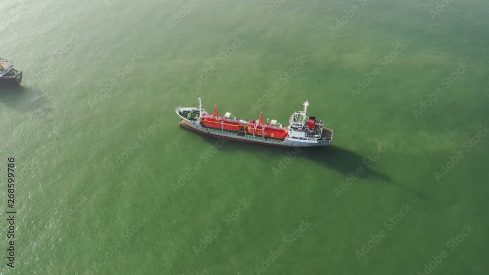 Aerial top view of the ship carrying the lpg and oil tanker in the sea port. For energy export and import business for transportation Aerial top view of the ship carrying the lpg and oil tanker in the sea port. For energy export and import business for transportation