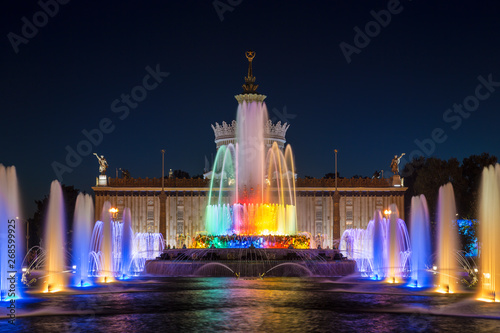 Fountain "Stone flower" on the background of the pavilion "Ukraine" on the territory of the All-Russian exhibition center (VDNH) at night. Moscow, Russia