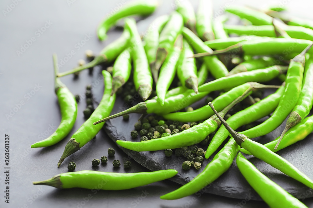 Hot green pepper. Chilean pepper on a black.