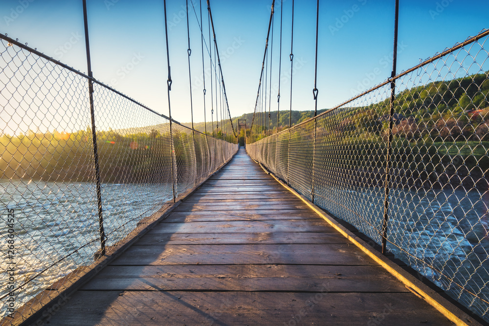 Suspension bridge over the river