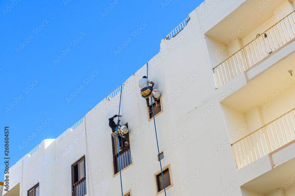 Rope access workers on a residential building in Hurghada, Egypt