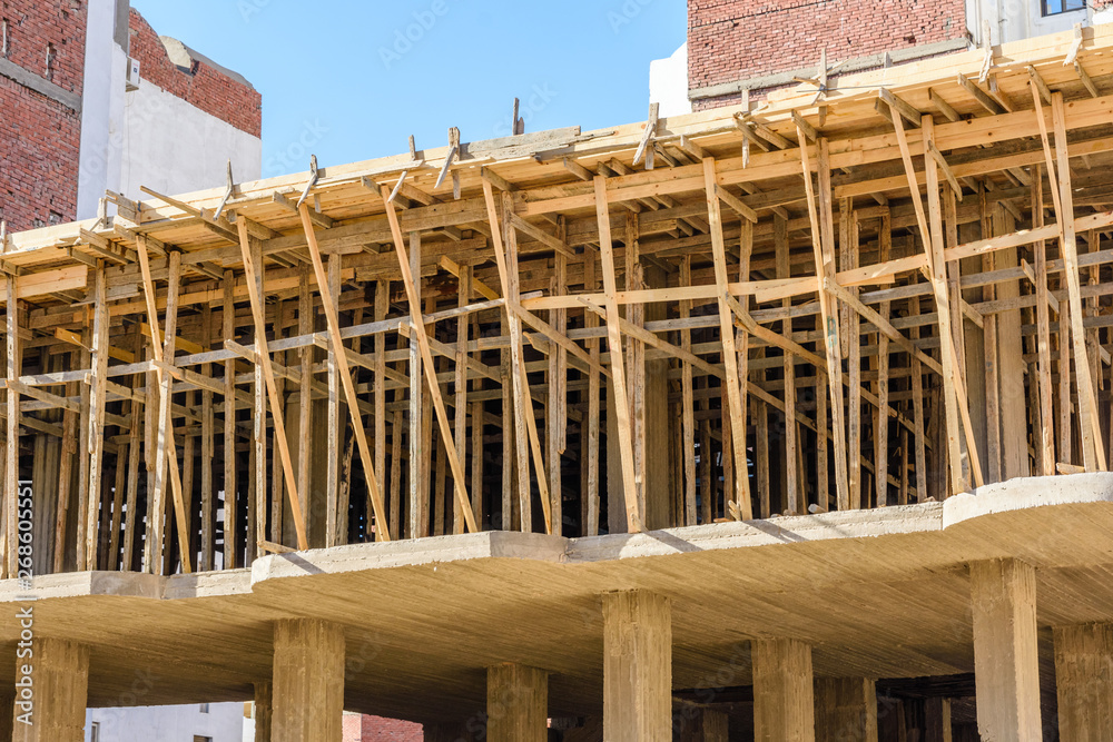 Construction of the new modern residential building, wooden framework. Hurghada, Egypt Construction of the new modern residential building, wooden framework. Hurghada, Egypt