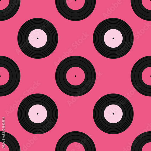 Vector seamless pattern background with cute pink phonograph records or vinyl records.