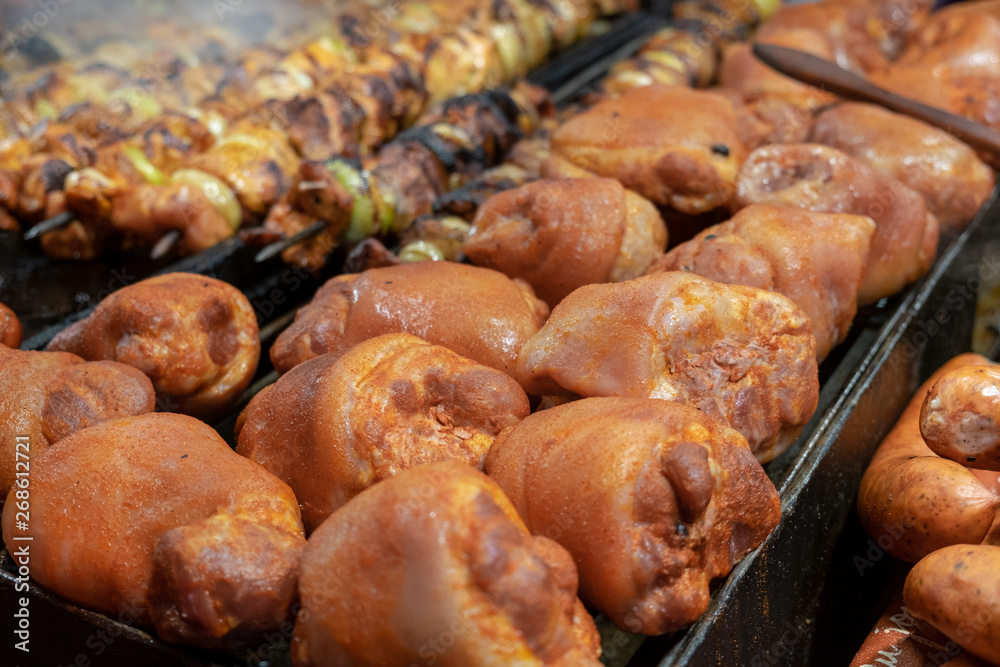 Roasted smoked pork legs for sale at christmas market. Krakow, Poland Roasted smoked pork legs for sale at christmas market. Krakow, Poland