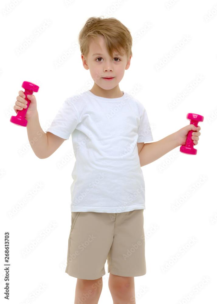 A little boy is lifting dumbbells. A little boy is lifting dumbbells.