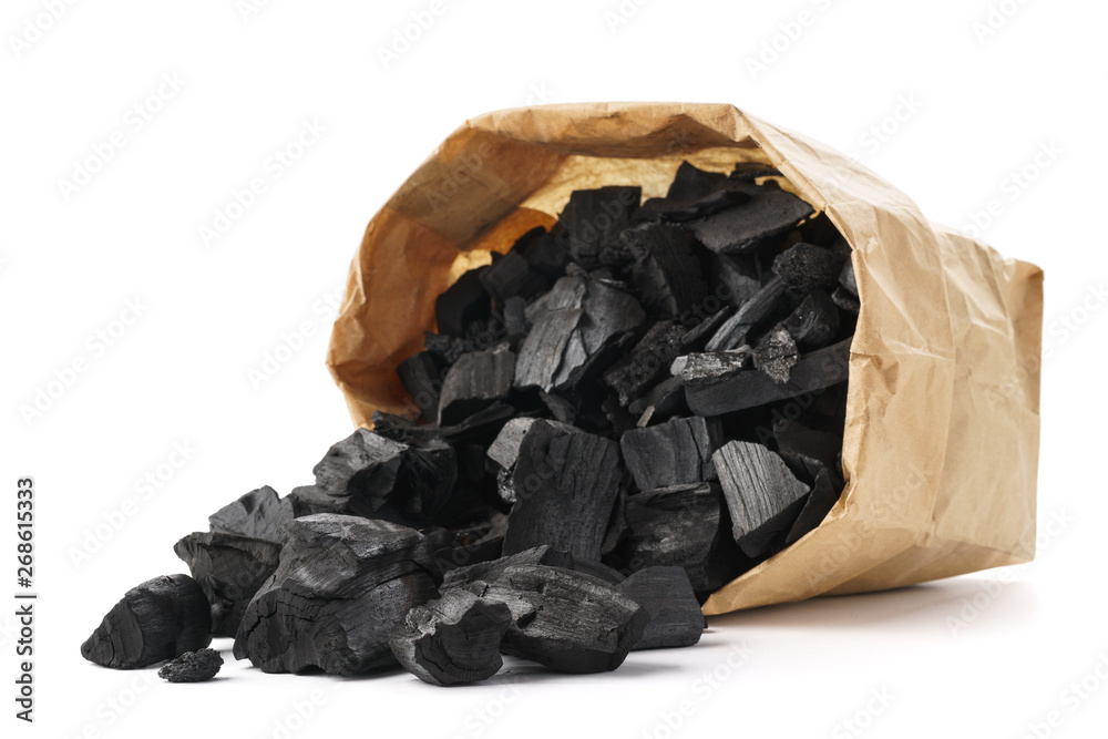 Charcoal in a paper bag for igniting fire in a grill.