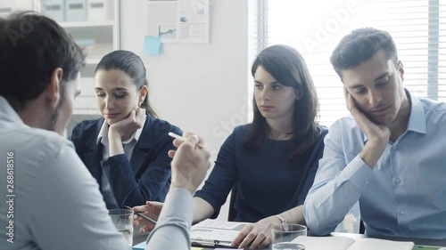 Recruitment team examining a boring talkative candidate