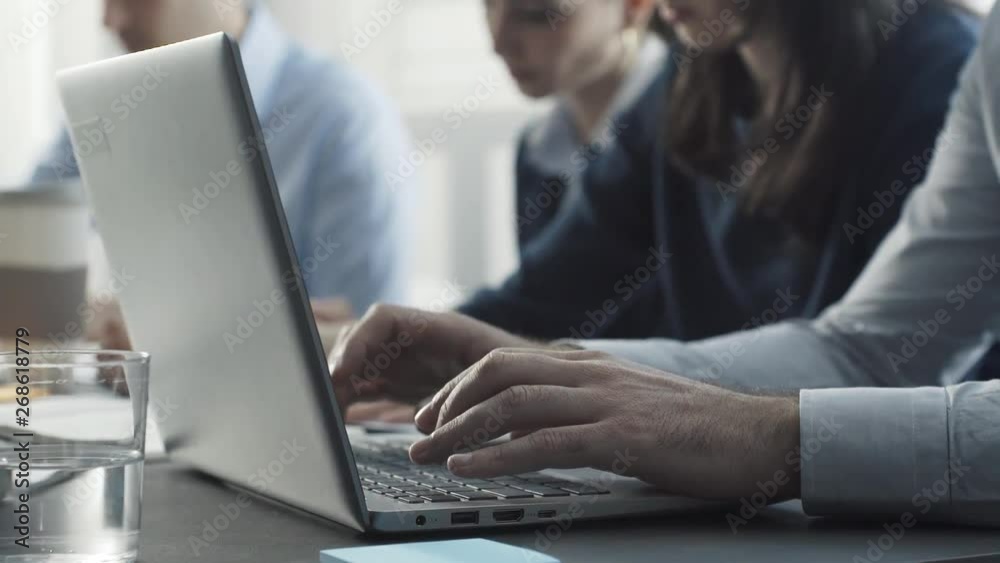 Corporate business team working together at desk Corporate business team working together at desk