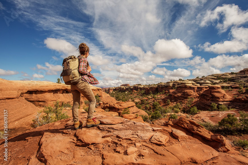 Hiker in Canyonlands National park, needles in the sky, in Utah, USA photo