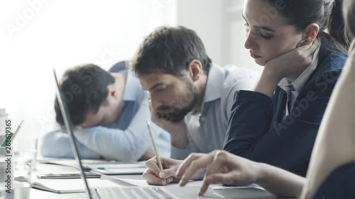 Lazy bored unproductive employees in the office