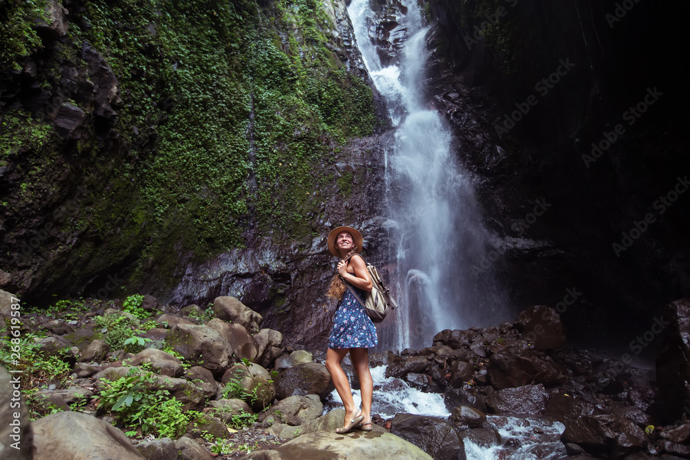 Woman near waterfal on Bali, Indonesia Woman near waterfal on Bali, Indonesia