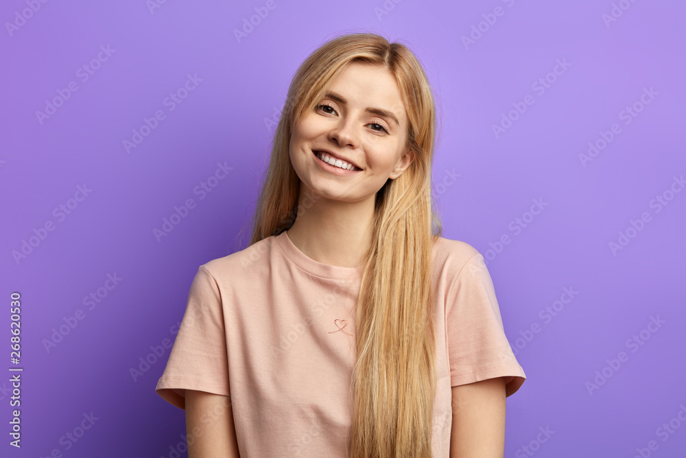 charming cheerful female student posing to the camera. emotion and feeling concepts charming cheerful female student posing to the camera. emotion and feeling concepts