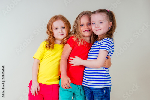 three little beautiful girls going on vacation at sea on white background