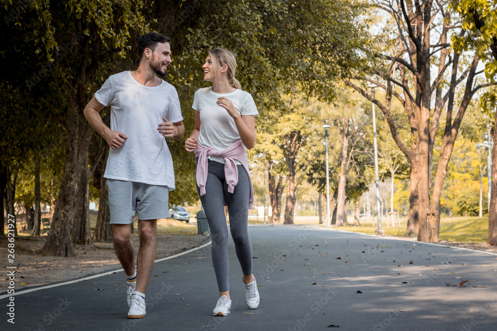 Young couples jogging in the park.