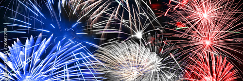 Fototapeta Blue white and red fireworks panoramic background, US 4th of July or France 14 J