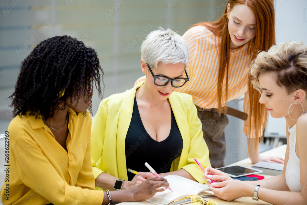 creative women facing the problem, glamour team having a collection of ideas. close up photo creative women facing the problem, glamour team having a collection of ideas. close up photo