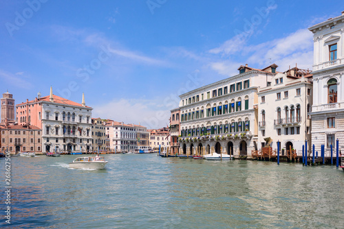 VENICE, ITALY - MAY, 2017: Beautiful view to colorful Venetian architecture located near Ponte di Rialto/ Rialto bridge, water tram stop/station at the Canal Grande © Stanislav Samoylik