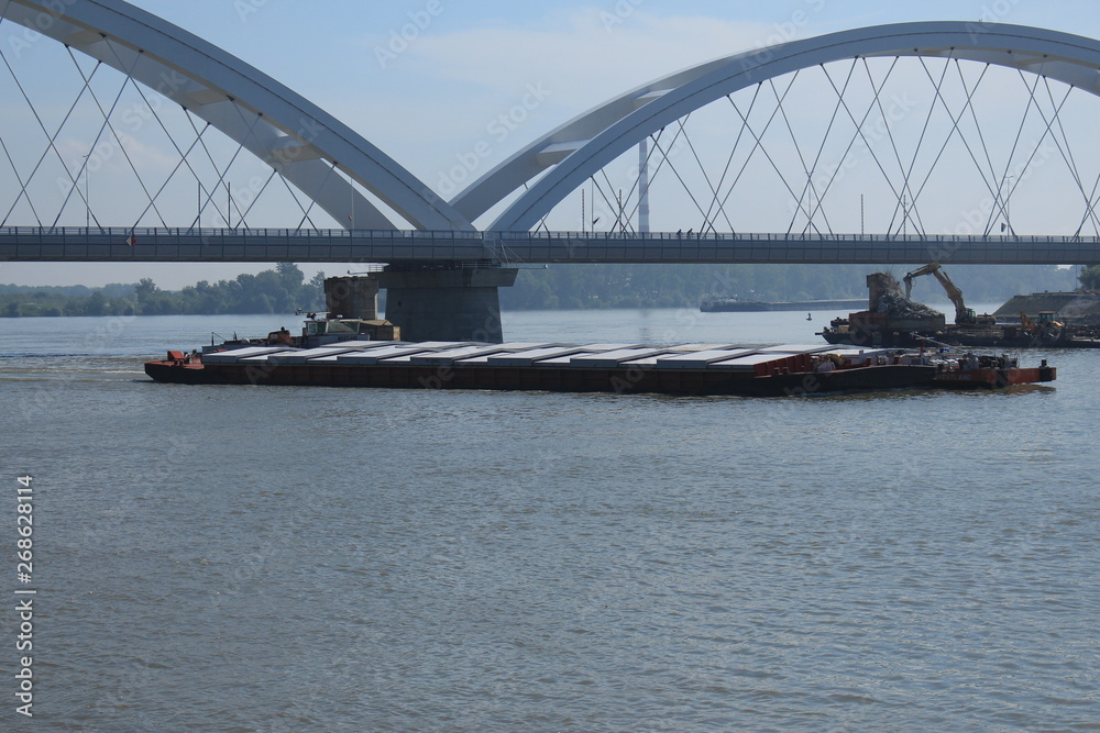 Naklejka premium Barges under Zezelj bridge on Danube