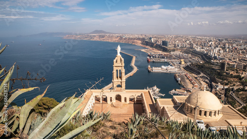 Mountain top cathedral and panorama skyline view of Oran, Algeria photo