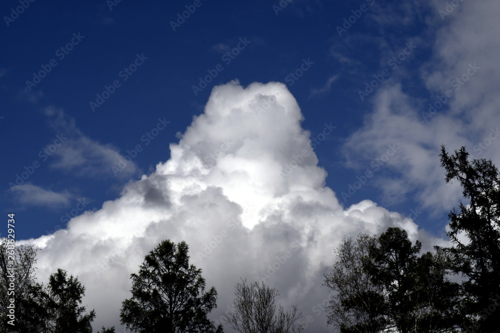 Cumulus clouds gather as a cone in the sky Cumulus clouds gather as a cone in the sky