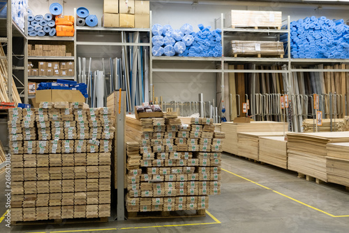 ST. PETERSBURG, RUSSIA - MARCH, 2019: Wood stacked on shelving inside a lumber yard