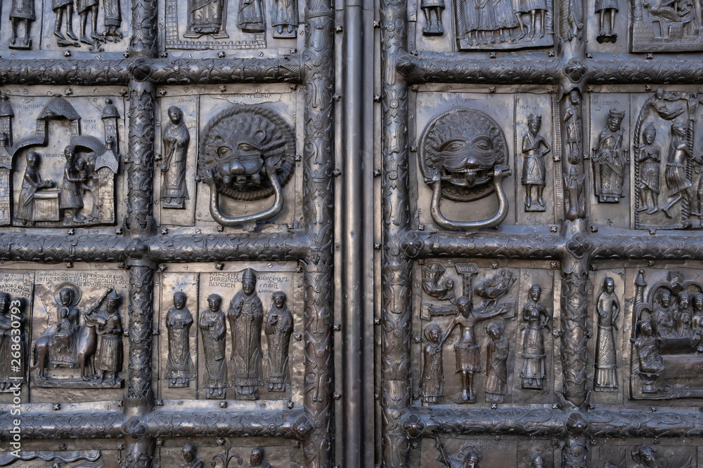 Close-up of theancient bronze Magdeburg Gates (1153) of Saint Sophia Cathedral in Veliky Novgorod
